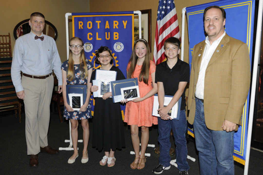 The 2016 8th Grade Essay Contest Winners from left to right are Rotary President Elect Scott Bridgeford, Mary Beloat, Mia Crooms, Mackenzie Dodge & Zayn Odell all from HNMS and Rotary President Dan Sulger.